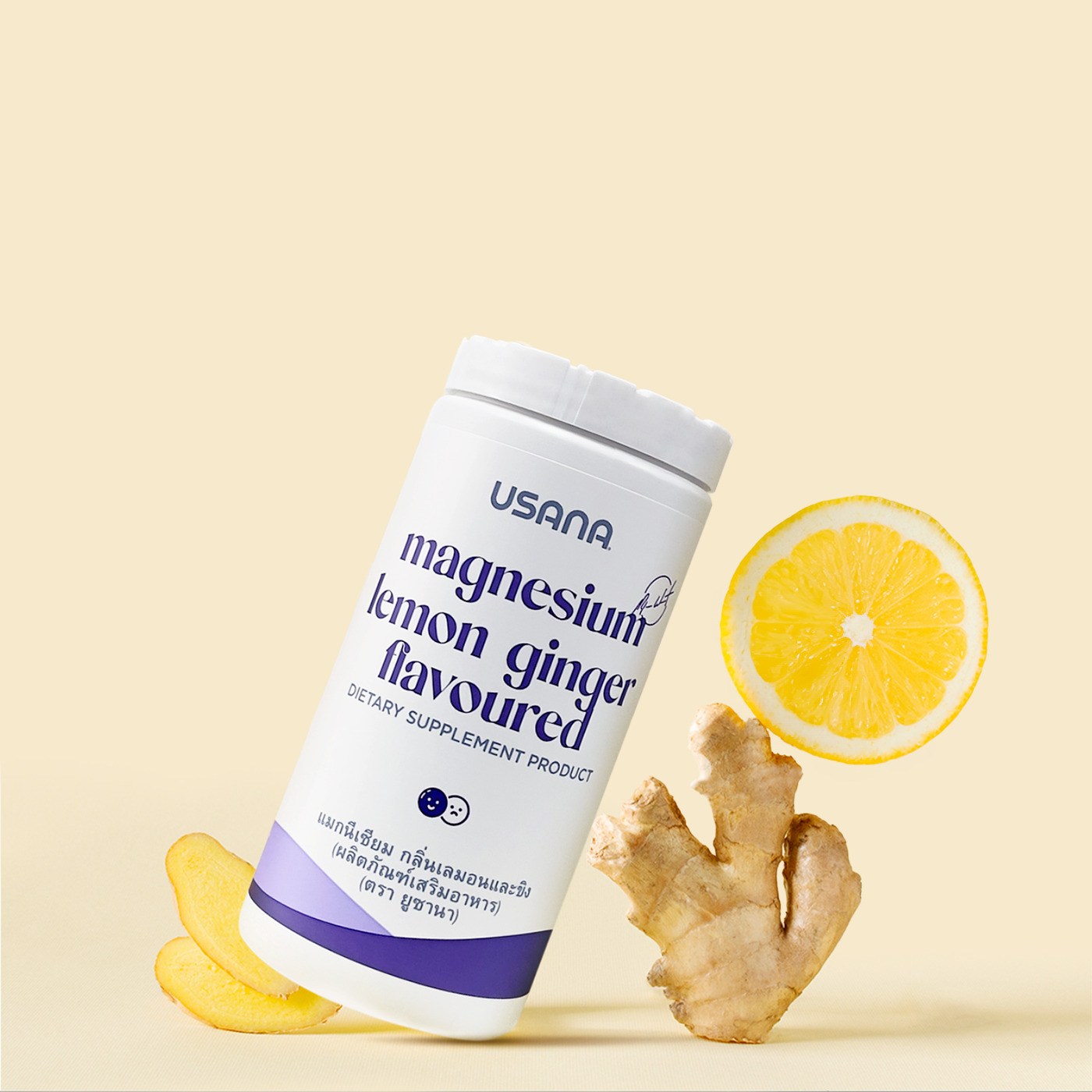 A Usana supplement tub floating beside lemon slices and ginger