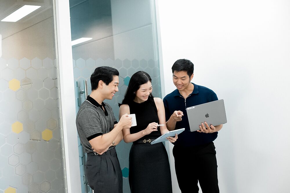 Primal colleagues sharing a laptop screen
